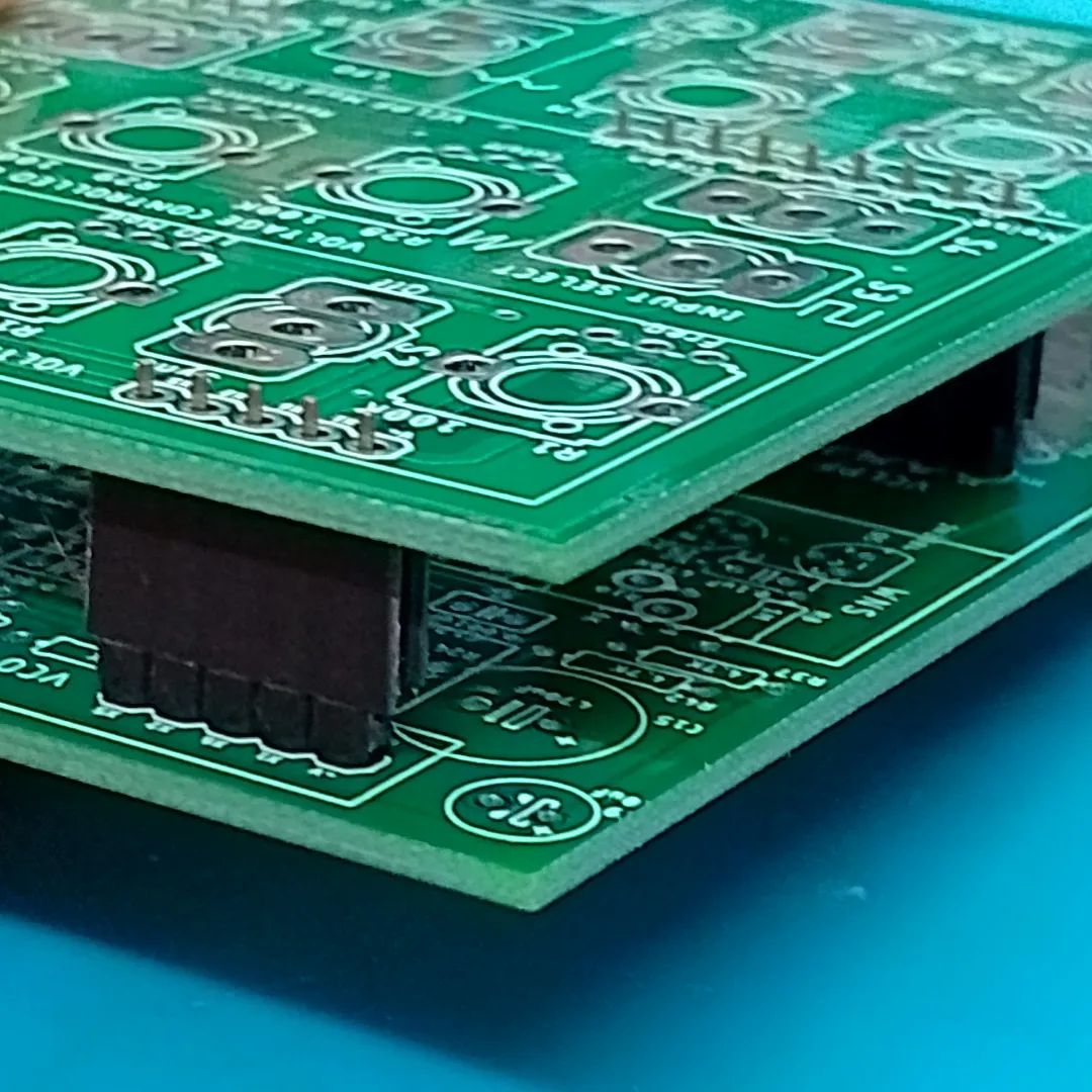 The top and bottom PCBs sandwiched through SIL male and female headers. 